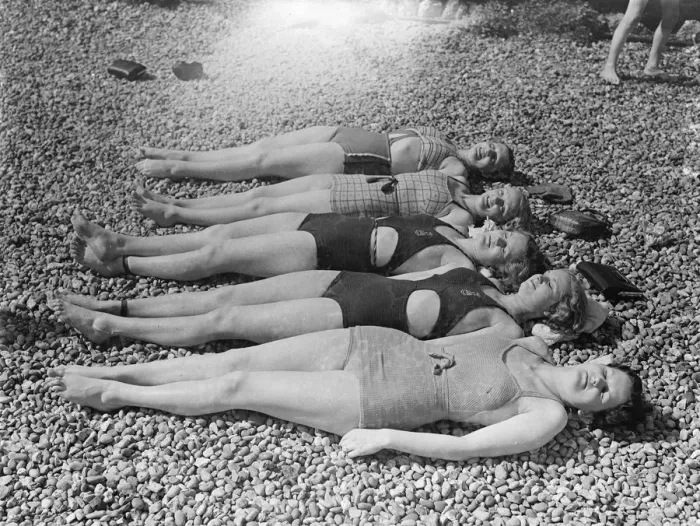 Framed Print : Girls lying on the beach in the sunshine. 25 May 1937 [?]