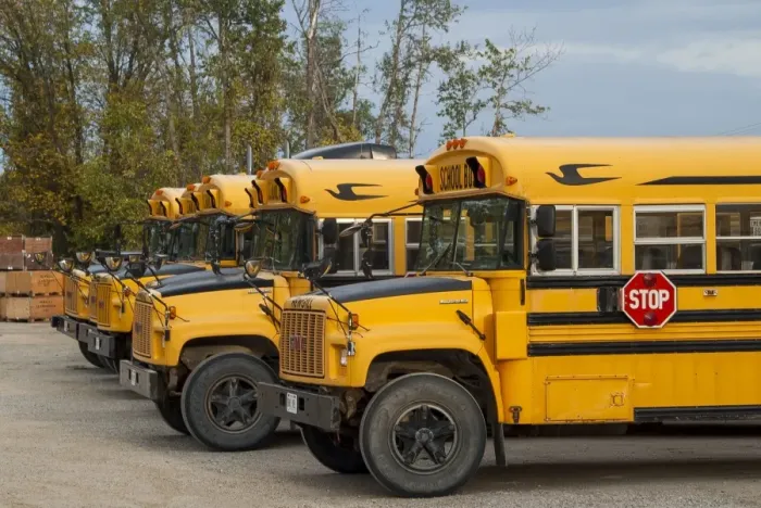 Framed Print : GMC school busses parked up at their depot