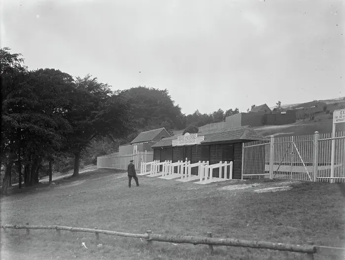 Framed Print : Goodwood racecourse. The gates at the entrance to Trundle Hill, which has now been enclosed