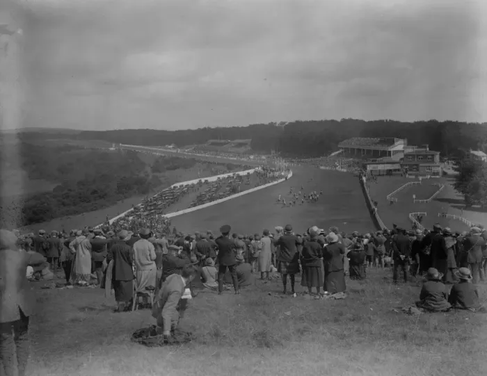 Framed Print : The Goodwood races. A striking general view of the racecourse, stands and enclosures Framed Print : The Goodwood races. A striking general view of the racecourse, stands and enclosures
