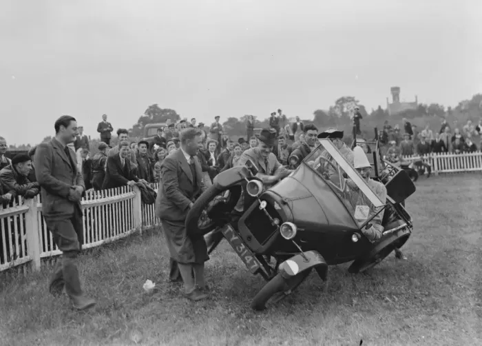 Framed Print : The Gravesend and District Motor Cycle Gymkhana. Clown driving a car on two wheels Framed Print : The Gravesend and District Motor Cycle Gymkhana. Clown driving a car on two wheels