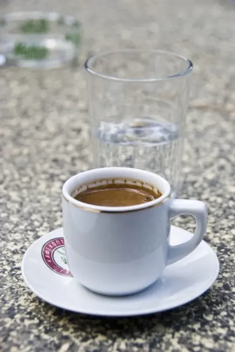 Framed Print : Greek coffee and glass of water on table of restaurant in Cyprus hills. credit Framed Print : Greek coffee and glass of water on table of restaurant in Cyprus hills. credit