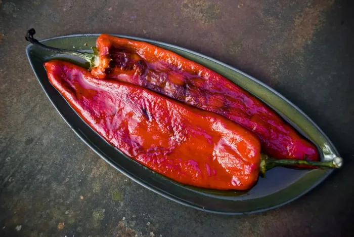 Framed Print : Grilled red peppers with blistered skins removed credit: Marie-Louise Avery / thePictureKitchen Framed Print : Grilled red peppers with blistered skins removed credit: Marie-Louise Avery / thePictureKitchen