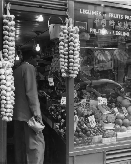 Framed Print : A grocer selling a variety of exotic fruit and legumes with a window sign in multiple languages Framed Print : A grocer selling a variety of exotic fruit and legumes with a window sign in multiple languages