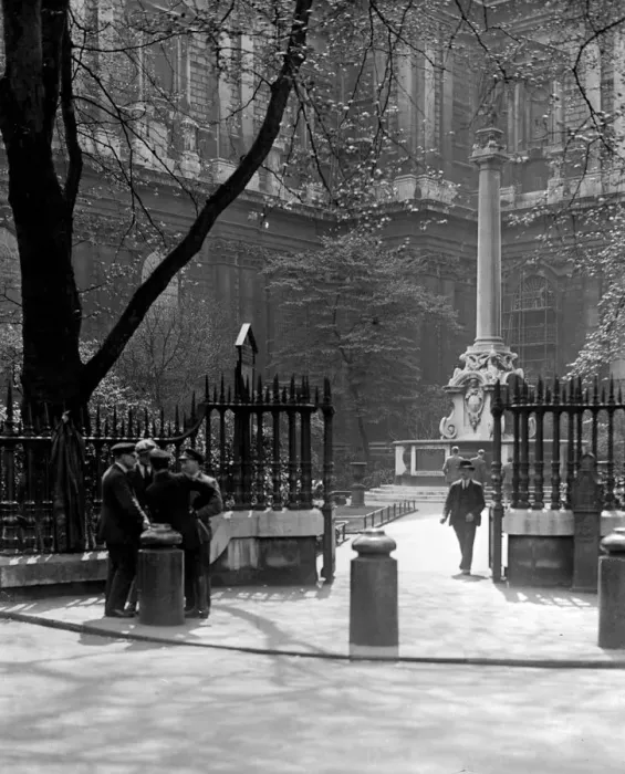 Framed Print : A group of men chat outside St Pauls Cathedral by Saint Pauls Church Yard