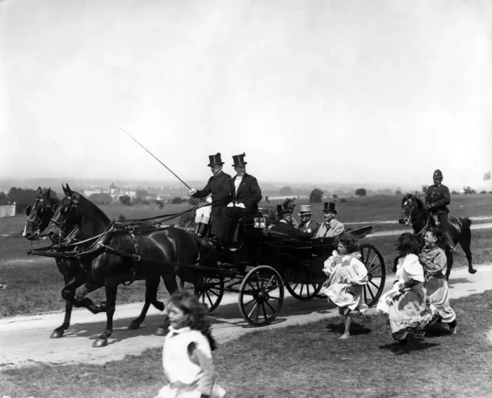 Framed Print : Gypsy children run after the Royal Carriage of King George V as they travel over Framed Print : Gypsy children run after the Royal Carriage of King George V as they travel over