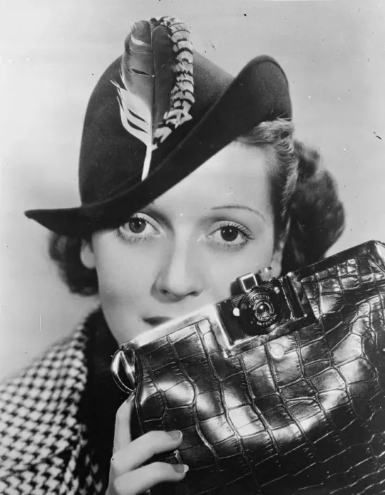 Framed Print : Handbag that sees all. Flap conceals a camera. The keen woman amateur photographer Framed Print : Handbag that sees all. Flap conceals a camera. The keen woman amateur photographer