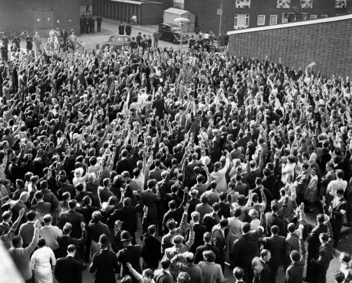 Framed Print : Hands shoot into the air to signify assent by St. Pancras tenants to the resolution