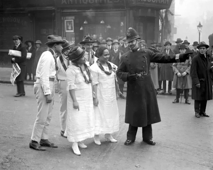 Framed Print : Hawaiians in London. A policeman directing them to Selfridge s. 28 January 1921 Framed Print : Hawaiians in London. A policeman directing them to Selfridge s. 28 January 1921