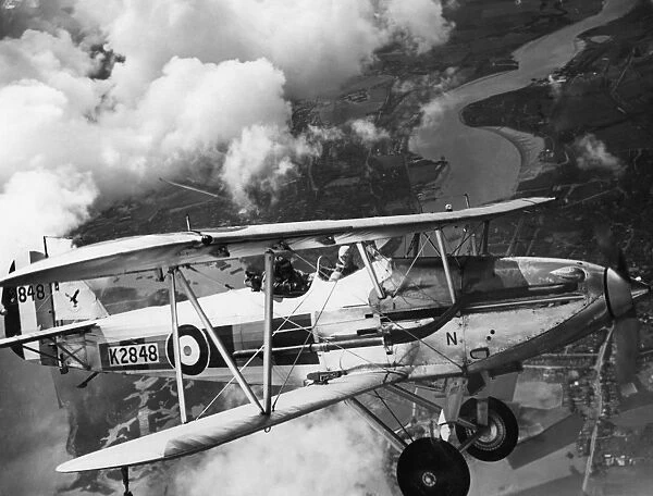 A Hawker Demon on a training flight over the Medway at Rochester, Kent, 1938