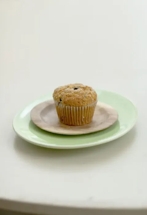 Framed Print : Healthy bran and raisin muffin on small wooden plate on green platter credit: Marie-Louise Framed Print : Healthy bran and raisin muffin on small wooden plate on green platter credit: Marie-Louise