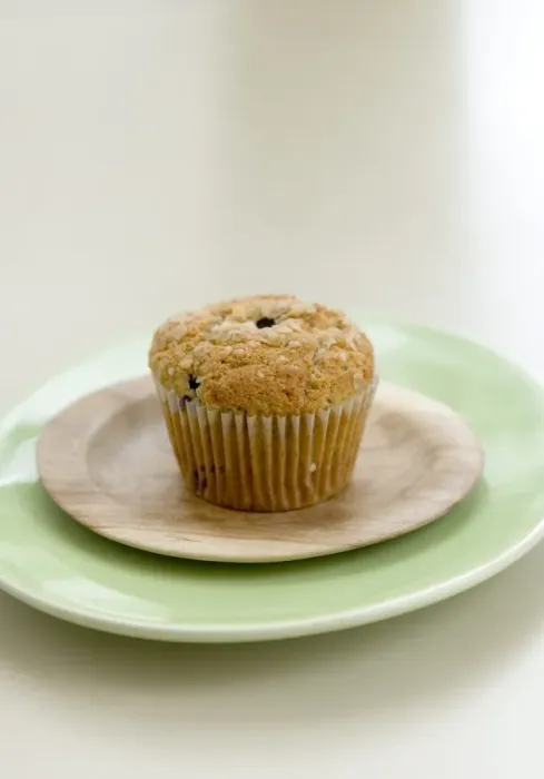 Framed Print : Healthy bran and raisin muffin on small wooden plate on green platter credit: Marie-Louise Framed Print : Healthy bran and raisin muffin on small wooden plate on green platter credit: Marie-Louise