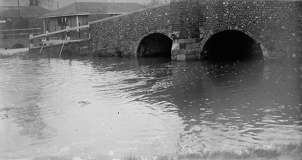 High water at the bridge crossing the River Darent at Shoreham, Kent
