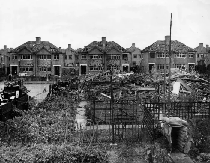 Framed Print : Home front 1940. A residential area showing signs of being heavily damaged after Framed Print : Home front 1940. A residential area showing signs of being heavily damaged after