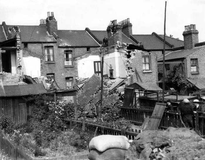 Framed Print : Home front 1940. A residential area showing signs of being heavily damaged after Framed Print : Home front 1940. A residential area showing signs of being heavily damaged after