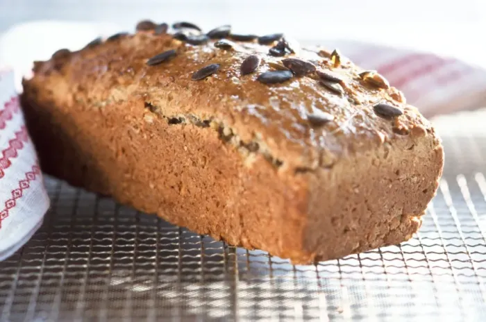 Framed Print : Homemade wholemeal loaf topped with pumpkin seeds, cooling on wire rack credit Framed Print : Homemade wholemeal loaf topped with pumpkin seeds, cooling on wire rack credit