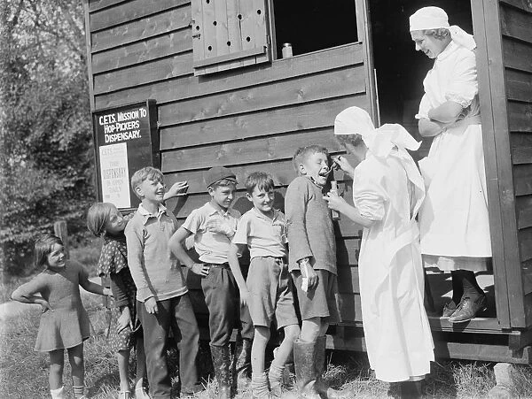 Hop - pickers dispensary, children receiving medicine. 1935