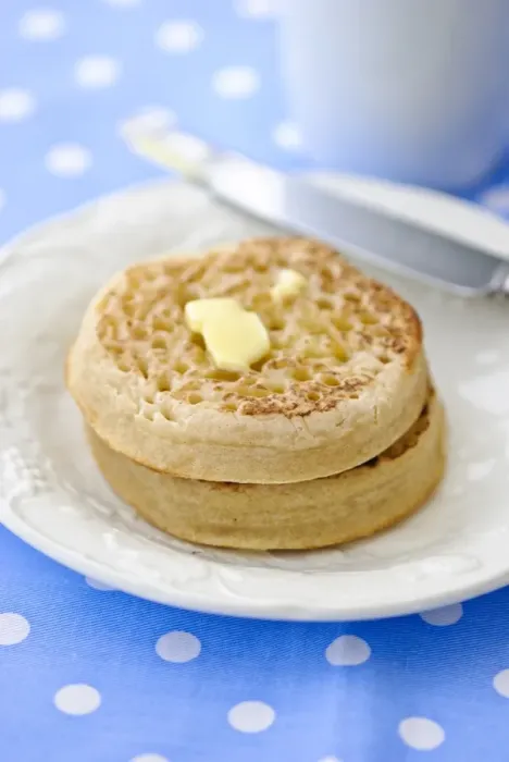 Framed Print : Hot buttered crumpets on white plate credit: Marie-Louise Avery / thePictureKitchen Framed Print : Hot buttered crumpets on white plate credit: Marie-Louise Avery / thePictureKitchen
