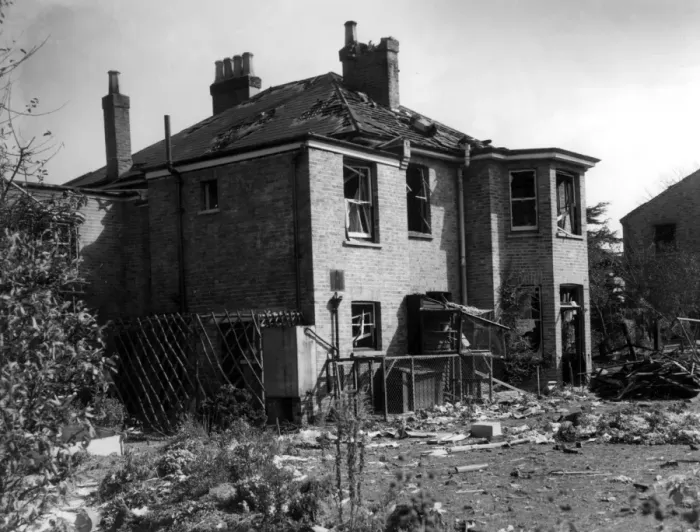 Framed Print : A house in the Bexley area, showing considerable damage, surrounded by debris after