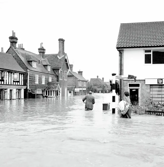 Framed Print : Householders salvaging what belongings they can - at the Southern end of High Street Edenbridge Kent on Sunday evening. Note the wellington boot stuck on the signpost! 11 September 1968
