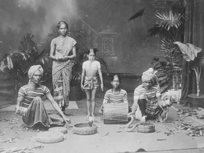 Framed Print : Indian types. An Indian juggler and his assistants, giving an exhibition of snake charming Framed Print : Indian types. An Indian juggler and his assistants, giving an exhibition of snake charming