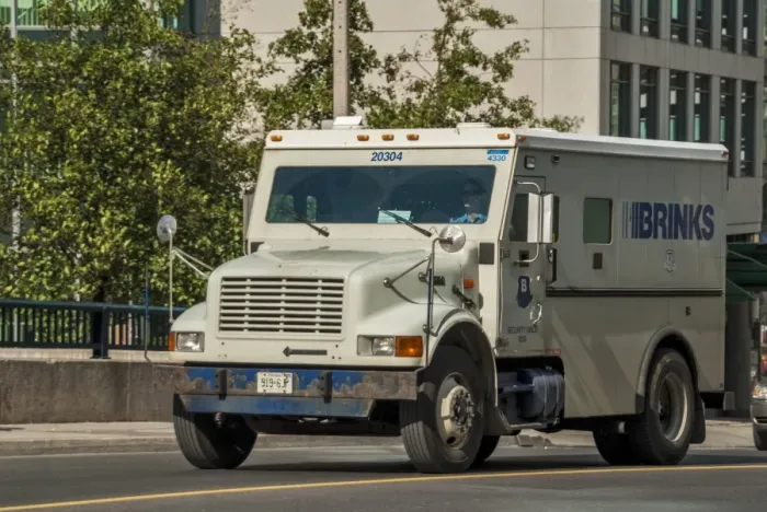 Framed Print : An International small 4 wheeled box van, amoured secuity vehicle in downtown toronto