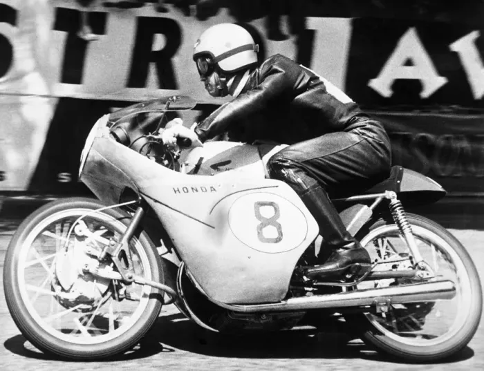 Framed Print : Isle of Man: Japanese rider Taniguchi on a Honda machine racing round the Manx track Framed Print : Isle of Man: Japanese rider Taniguchi on a Honda machine racing round the Manx track