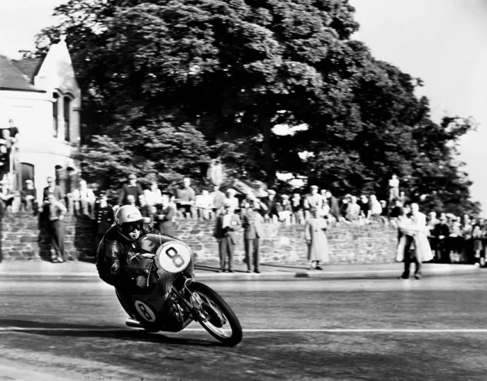 Framed Print : Isle of Man: N Taniguchi of Japan takes the corner at speed, riding a 125cc Japanese honda Framed Print : Isle of Man: N Taniguchi of Japan takes the corner at speed, riding a 125cc Japanese honda