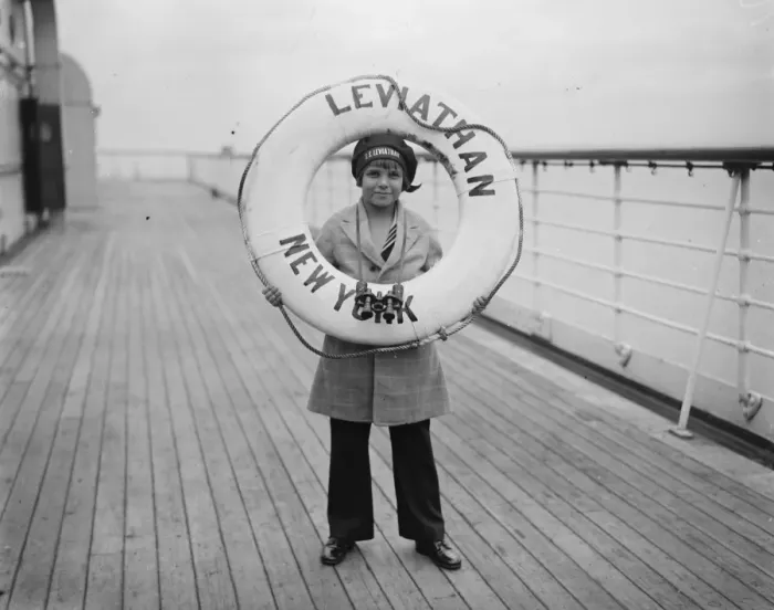 Framed Print : Jackie arrives at Southampton. Jackie Coogan photographed standing behind one of Framed Print : Jackie arrives at Southampton. Jackie Coogan photographed standing behind one of
