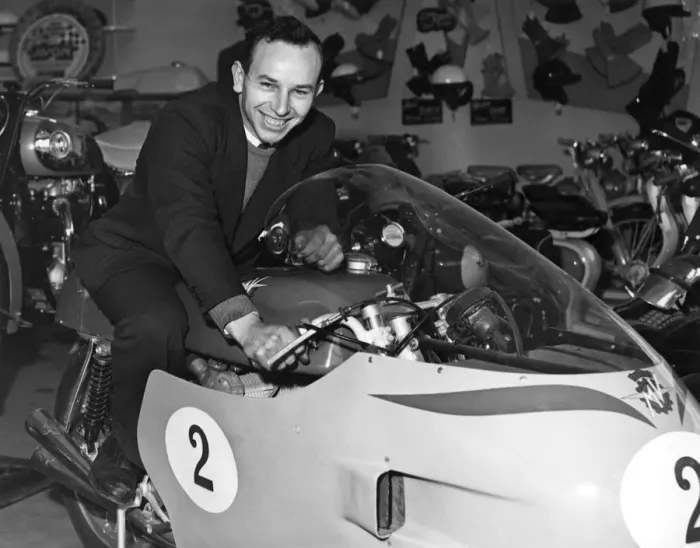Framed Print : John Surtees sitting astride his racing MV Augusta motorbike inside his family motorcycle