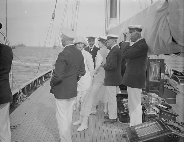 The King takes the wheel of his yacht Britannia. 7 August 1924