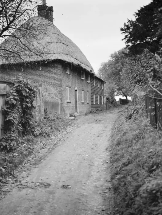 Framed Print : A lane past thatched cottages at Womenswold, Kent. 1937 Framed Print : A lane past thatched cottages at Womenswold, Kent. 1937