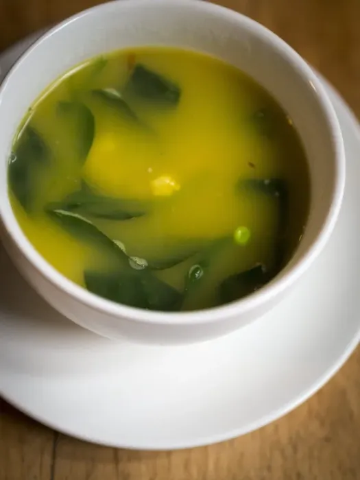 Framed Print : Light fresh soup made of lobster stock with saffron, prawns, peas and baby spinach