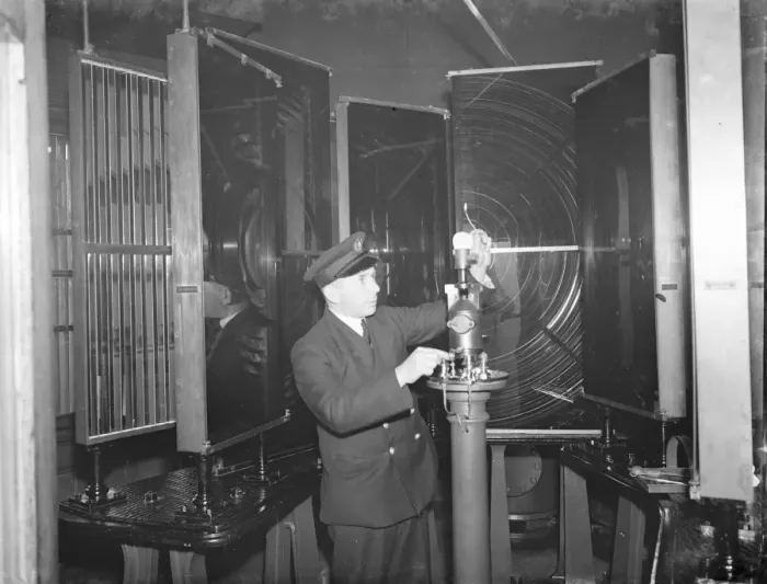 Framed Print : A lighthouse keeper checks the Dungeness lighthouse bulb in the lantern room Framed Print : A lighthouse keeper checks the Dungeness lighthouse bulb in the lantern room