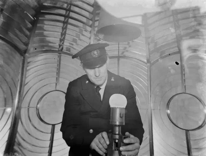 Framed Print : Lighthouse keeper J H Sole checks the Dungeness lighthouse bulb in the lantern room Framed Print : Lighthouse keeper J H Sole checks the Dungeness lighthouse bulb in the lantern room