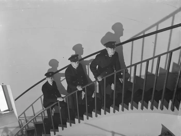 Framed Print : LIghthouse keepers walking up the spiral staircase inside the Dungeness lighthouse, Kent Framed Print : LIghthouse keepers walking up the spiral staircase inside the Dungeness lighthouse, Kent
