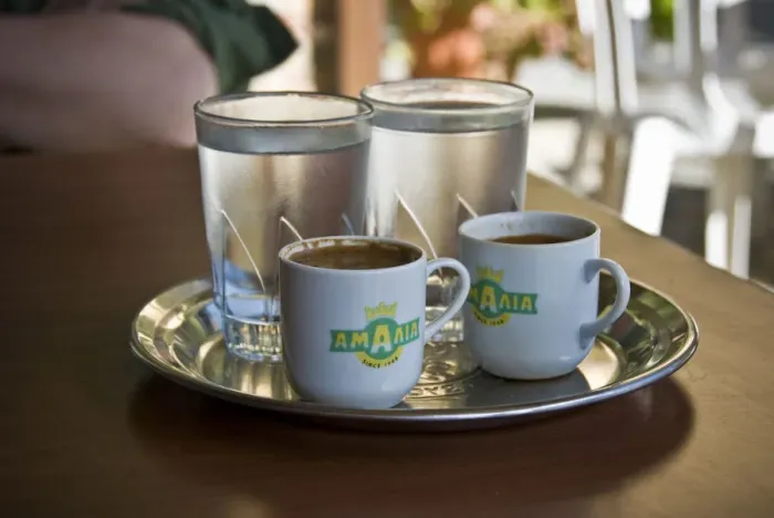Framed Print : Two little cups of Greek coffee with accompanying glasses of water served in Cypriot Framed Print : Two little cups of Greek coffee with accompanying glasses of water served in Cypriot