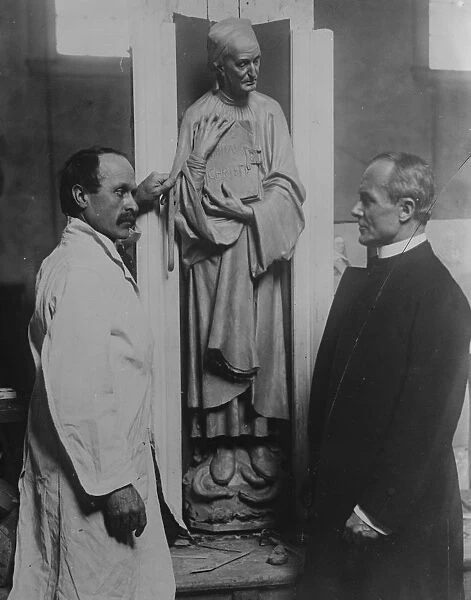 London sculptor at work in New York Cathedral. Mr John Angel, the well known London Sculptor