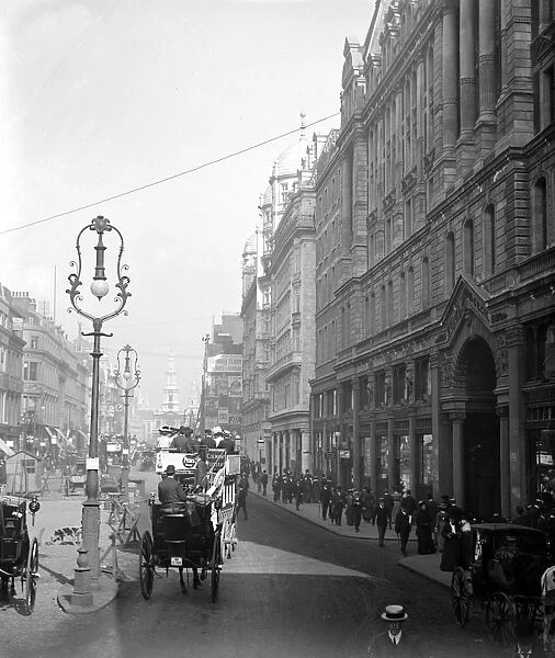 London street scene. Looking down the busy Strand to St Mary - le - Strand church, London