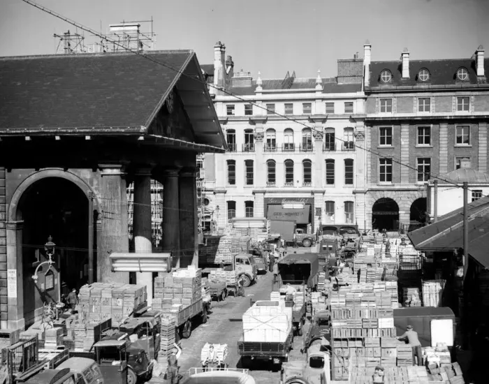 Framed Print : Looking down on a busy Covent Garden flower, fruit and vegetable market full of stacked fruit Framed Print : Looking down on a busy Covent Garden flower, fruit and vegetable market full of stacked fruit
