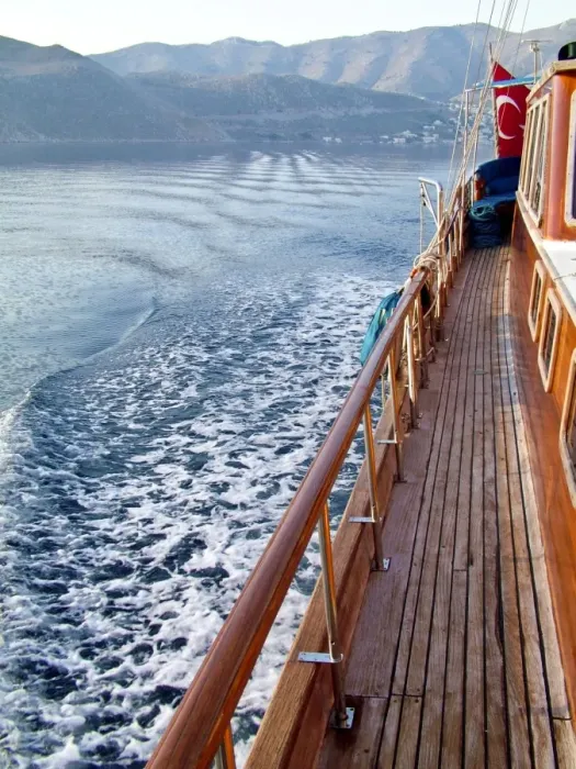 Framed Print : Looking back at the wake of Turkish gulet sailing among Greek islands in early morning