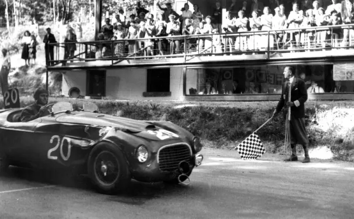 Framed Print : Luigi Chinetti in his Ferrari car passing the finishing line in the 24-hour race Framed Print : Luigi Chinetti in his Ferrari car passing the finishing line in the 24-hour race