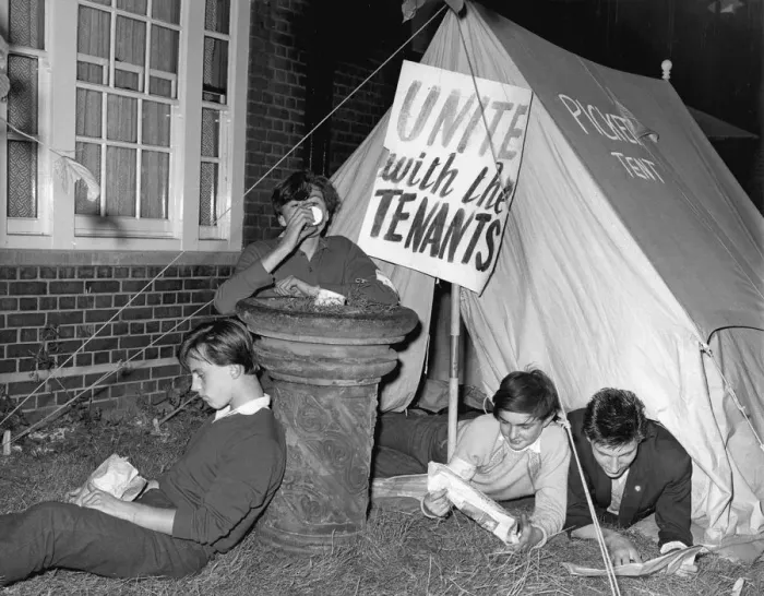 Framed Print : Lying close to their picket tent, youngsters keep a lonely vigil outside Kennistoun House Framed Print : Lying close to their picket tent, youngsters keep a lonely vigil outside Kennistoun House