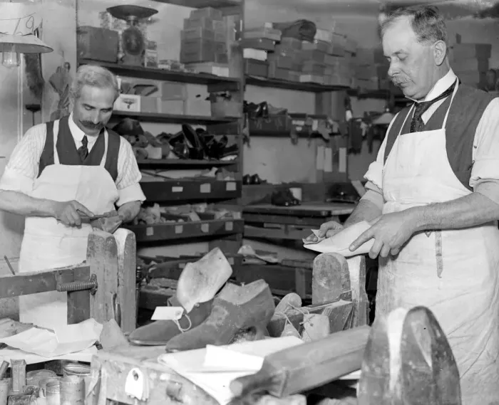Framed Print : Making of wooden shoe lasts ( W. H. Smith, Sloane Street ). Smoothing after shaping the last