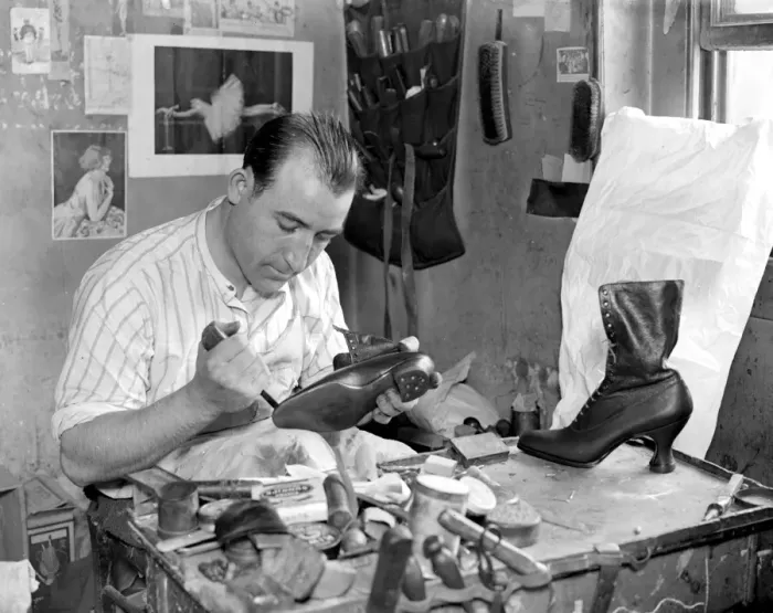 Framed Print : Making of wooden shoe lasts ( W. H. Smith, Sloane Street ). Finishing off a pair Framed Print : Making of wooden shoe lasts ( W. H. Smith, Sloane Street ). Finishing off a pair