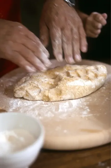 Framed Print : Man kneading and rolling pastry with little girl helping - hands only shown credit Framed Print : Man kneading and rolling pastry with little girl helping - hands only shown credit