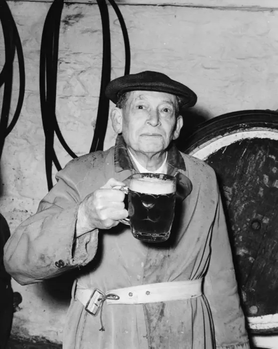 Framed Print : Man with a pint of beer at the Blue Anchor in Helston, Cornwall, England. 11 April 1956 Framed Print : Man with a pint of beer at the Blue Anchor in Helston, Cornwall, England. 11 April 1956