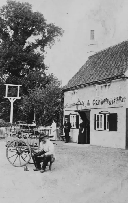 Framed Print : A man with a small cart outside public house at Eversley 1906
