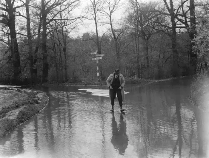 Framed Print : A man walks through the floods in Hockenden, Kent. 1937 Framed Print : A man walks through the floods in Hockenden, Kent. 1937