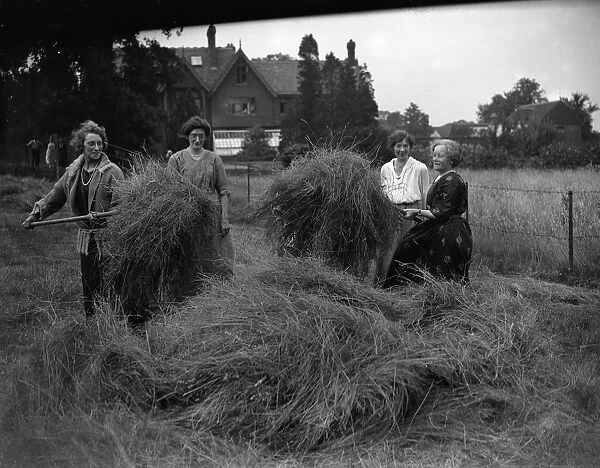 At the Mary Macarthur Holiday Home for Working Women in Ongar in Essex, haymaking gets under way